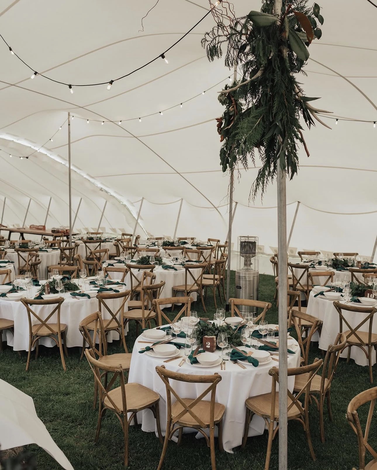 Beautifully styled reception beneath a Safari Stretch Tent